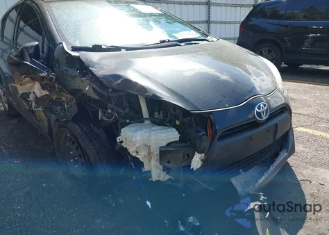 2015 Toyota Prius C One from USA, damaged, VIN JTDKDTB38F1113574